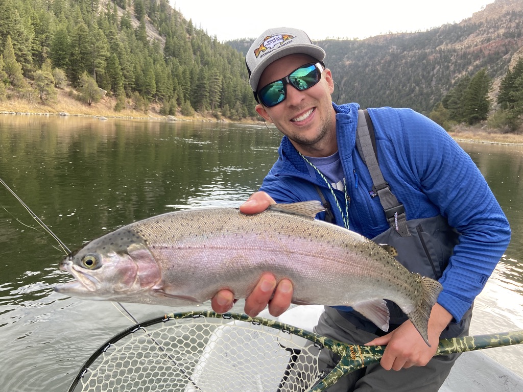 Angler with rainbow trout